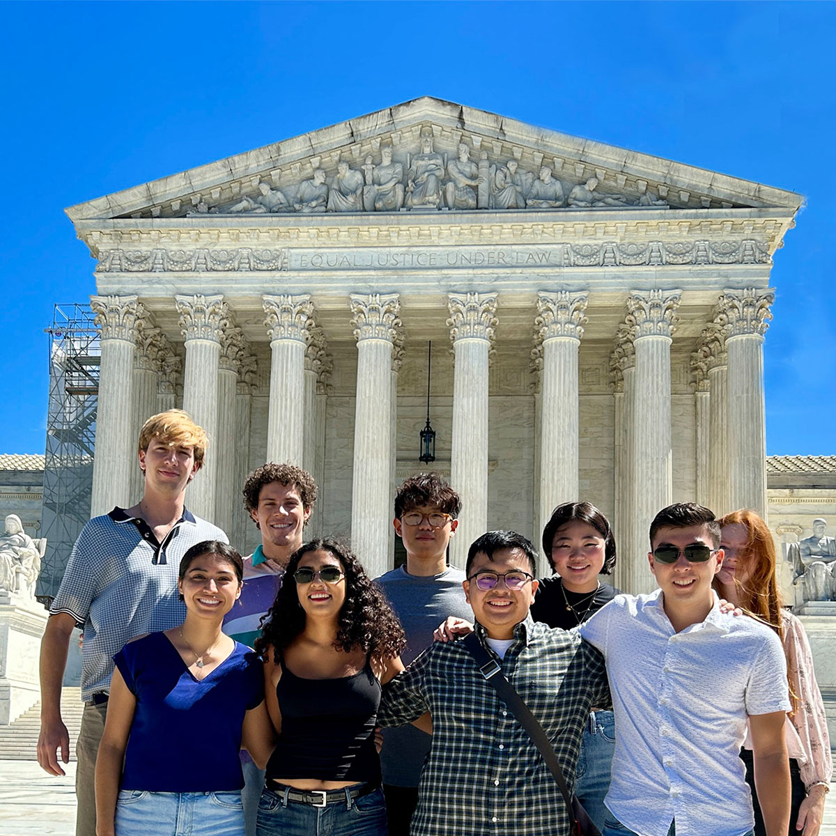 The 2023 Washington Program interns posing in front of the Supreme Court building in Washington, D.C.