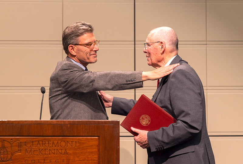 President Chodosh presenting John Roth (right) an award.
