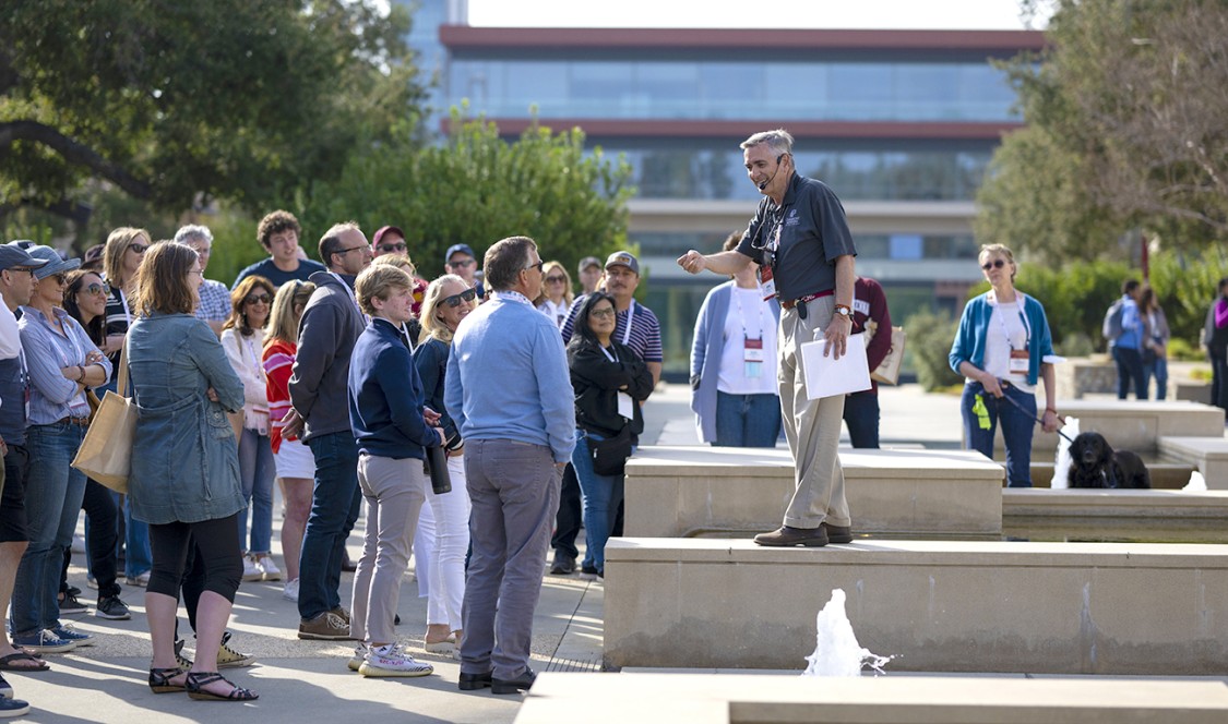 John Faranda '79 leads a tour group on a sunny day during Family Weekend 2022.