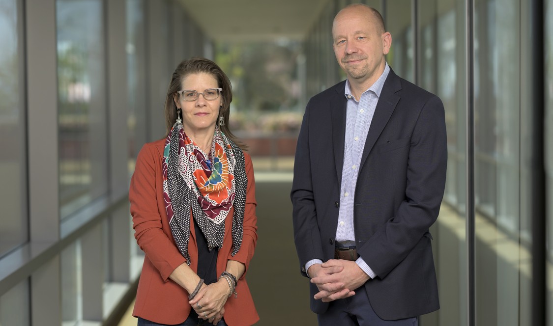CMC Professors Heather Ferguson and Jon Shields in the hallway of Kravis Center.