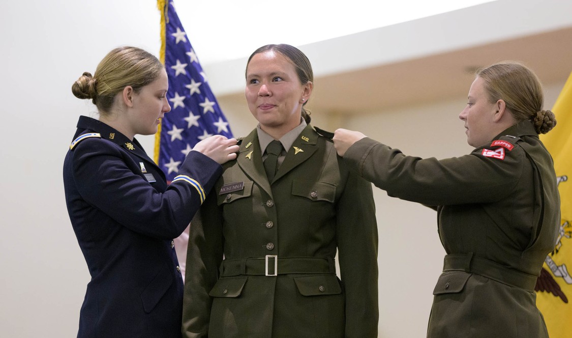 Cooper McKenna having her rank pinned on uniform