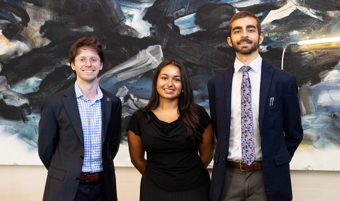 2026-27 Ath Fellows: Jasper Langley-Hawthorne ’27, Ambika (Bika) Gupta ’27, and Shivom Parihar ’28 standing in the Ath