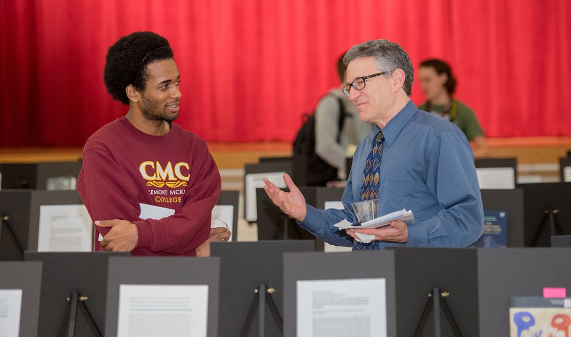 Student and professor discuss research