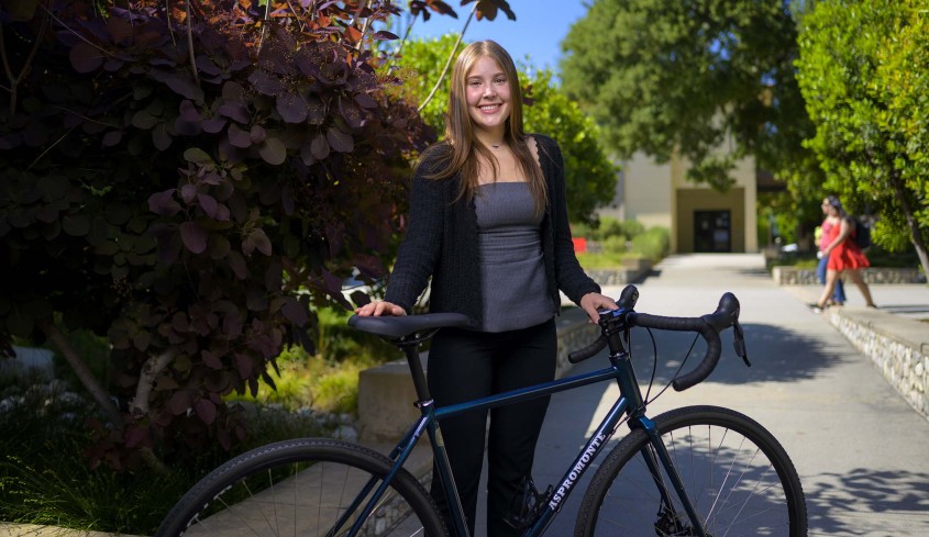 Josephine Aspromonte standing with bike