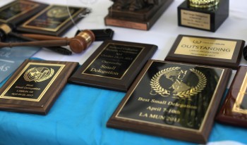 Flatlay photo of CMC MUN's recent awards