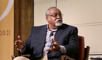 Brown University economist and noted heterodox thinker Glenn Loury holds a discussion on stage at the Ath with CMC Professor Michael Fortner.