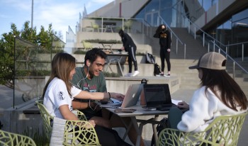 Students work together on the Colorado Terrace by Roberts Pavilion.