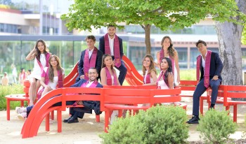 Graduates for Class of 2023 posing in front of the benches.