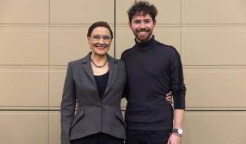 Stephanie Kleine-Ahlbrandt P’25  standing with her son, Adrian Flynn '25