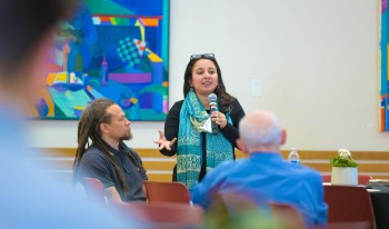 Prof. Radhika Koul speaking in front of class