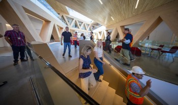 People walking down the stairs Inside the RDSC building