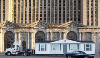 Mike Kelley's Mobile Homestead in front of the abandoned Detroit Central Train Station.