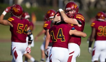 CMS football players celebrate
