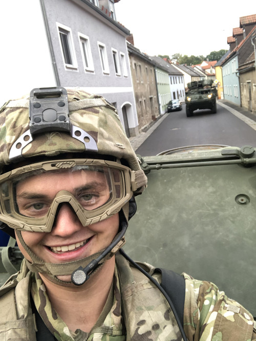 Ash taking a selfie with a tanker following behind his.