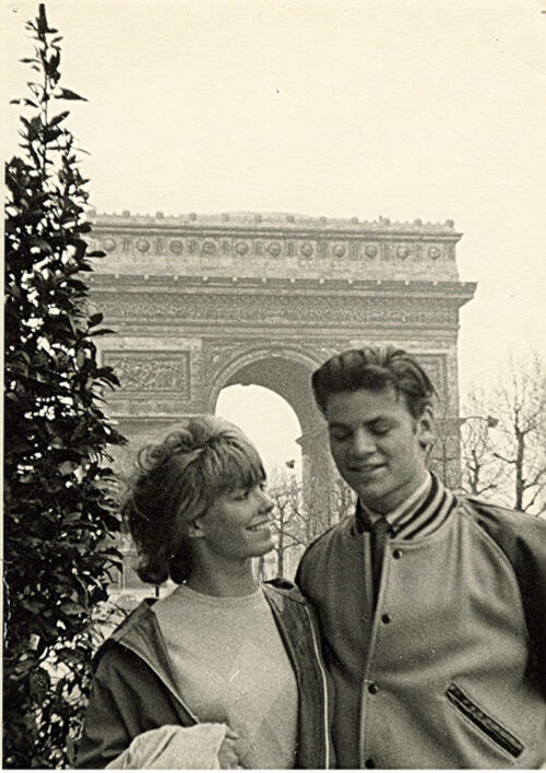 Woman and man looking at each other in Paris during Christmas time.