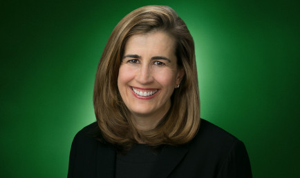 Studio portrait of Tina Daniels on green radial background