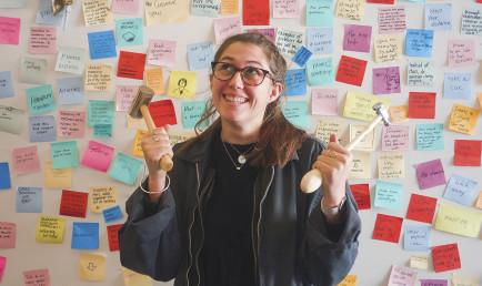 Anya Zimmerman-Smith '21 poses by a colorful iteration of her Honor Project