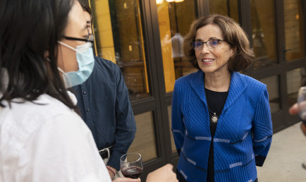 France A. Córdova engages with a group of Ath participants during the outdoor reception before her talk.