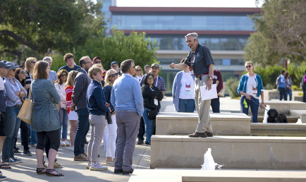 John Faranda '79 leads a tour group on a sunny day during Family Weekend 2022.