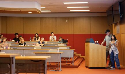 Student at podium presenting work from Summer Research Program
