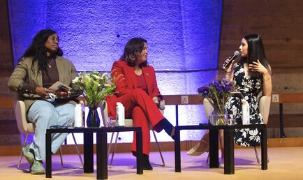 Malu Junco '27 on stage with two other women