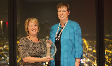 CMC Director of Off-Campus Studies Kristen Mallory (left) receives the Professional Development Award from Dr. Mary Dwyer, President and CEO of IES Abroad.