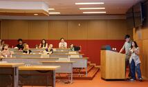Student at podium presenting work from Summer Research Program
